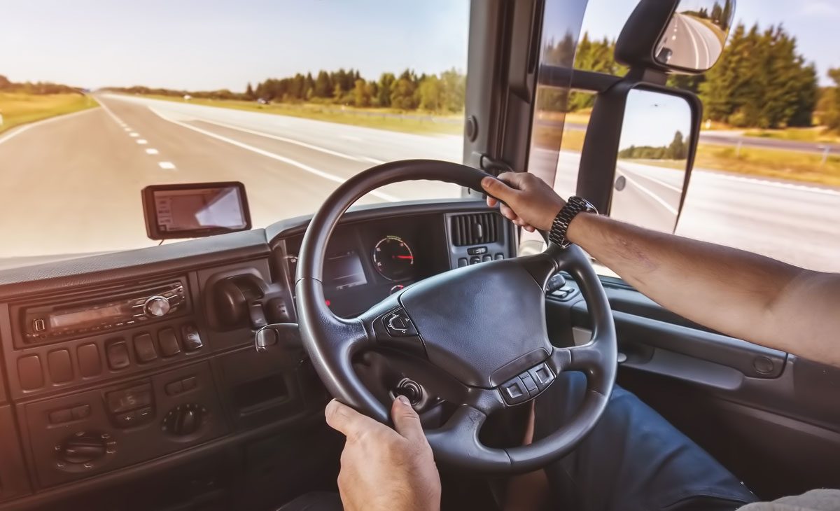 Driver,Of,Semi-truck,Sitting,And,Drining,His,Vehicle General haulage